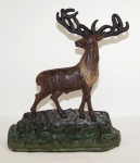 Click to view Antique Elk on Rocks Cast Iron Doorstop photos