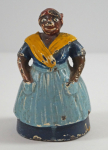 Click to view Antique Mammy w/ Apron Cast Iron Doorstop photos